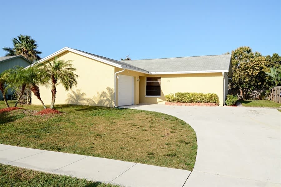 Front of 1371 Denlow Ln, Royal Palm Beach, FL
