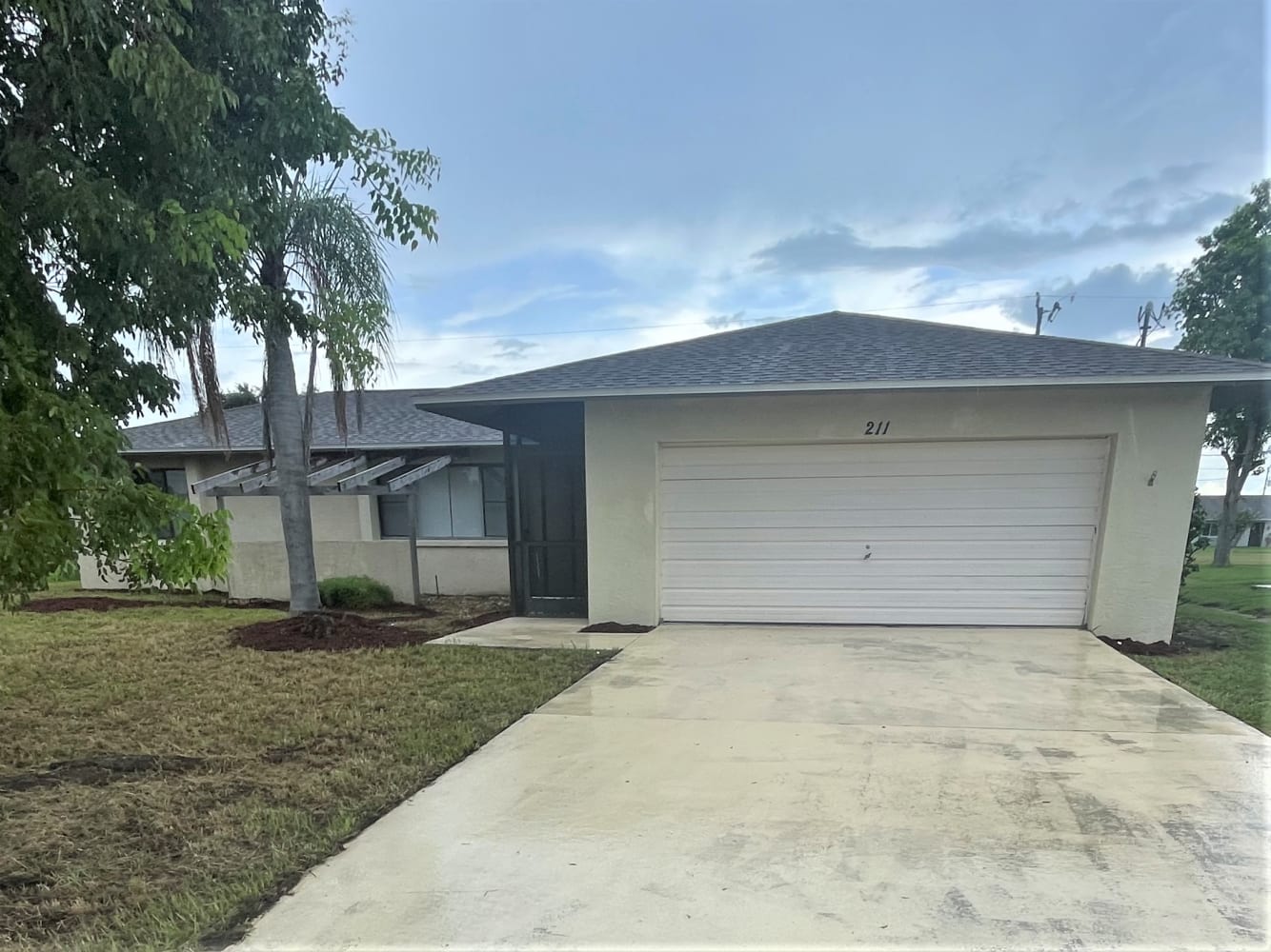 Front of 211 SE Santa Barbara Pl, Cape Coral, FL